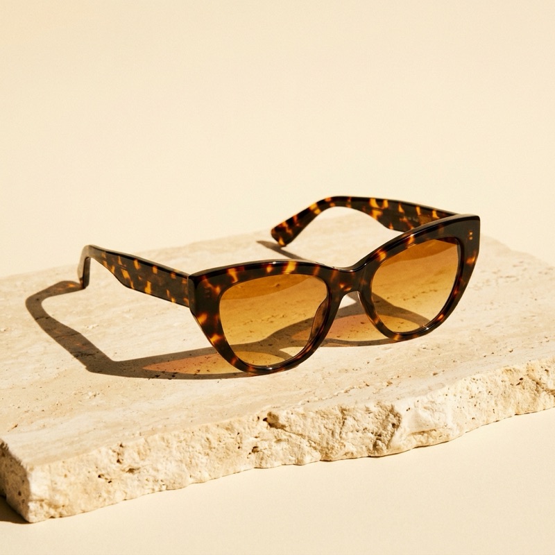 Tortoiseshell cat-eye sunglasses with amber gradient lenses.